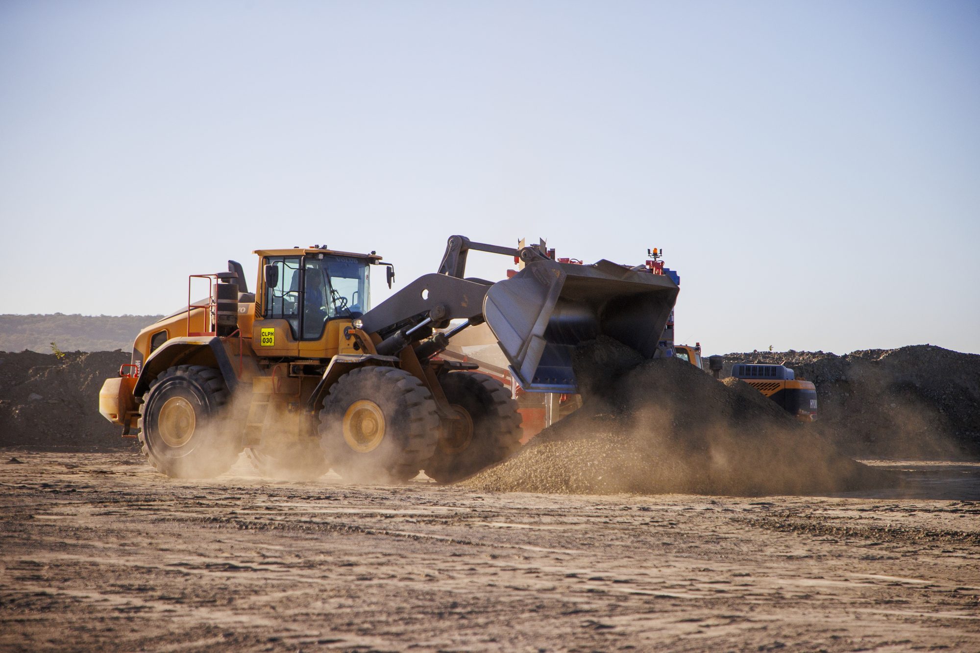 Volvo loader at industrial mining site by Jade Photography